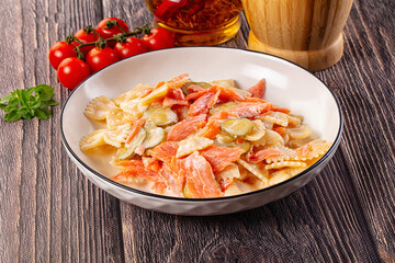 Italian pasta farfalle with salmon