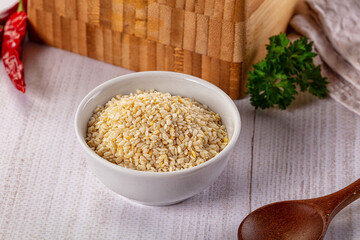 Raw dry sesame seeds heap
