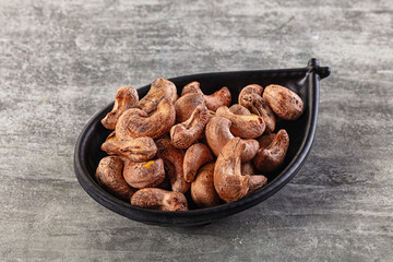 Unpeeled cashew nuts in the bowl