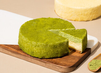 Matcha Cheesecake with a Slice Removed on wooden board side view of dessert cafe