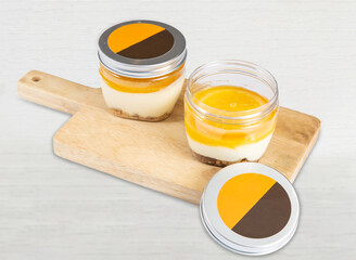 Gourmet Orange Chocolate Tiramisu in Jars on wooden board side view of Dessert Portions