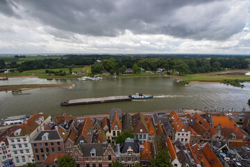 Deventer under a shower of hail. From a high angle view looking on the river the IJsel.