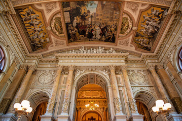 Ornate ceiling and columns in historic Burgtheater, Vienna
