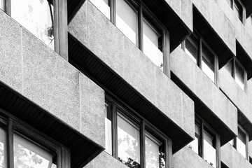 Brutalist Concrete Exterior With Repetitive Window And Balconies