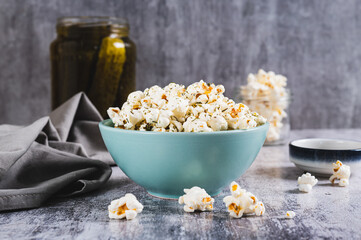 Pickles dill aromatic popcorn in a bowl on the table