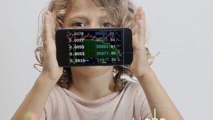 small girl holding smartphone in front of face with stock and trading data  - Powered by Adobe