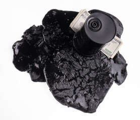 business concept,Black barrel with spilled oil isolated on white background