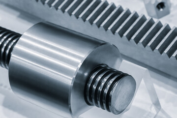 Close up of industrial metal screw shaft as part of screw transmission. Industrial background concept