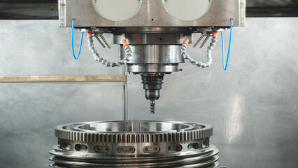 Large metal turbine on table of industrial metalworking programmable CNC machine, industrial...
