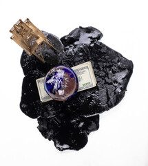 business concept,Black barrel with spilled oil isolated on white background