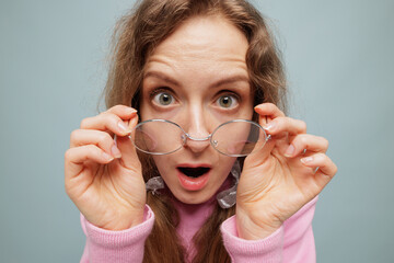 Surprised Woman Seeing Clearly for the First Time with Glasses