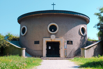 Vienna, Austria: chapel at Friedhof der Namenlosen, the Cemetery of the Nameless. Round concrete structure with circular windows, stairs, and a cross. Before Sunrise film location.