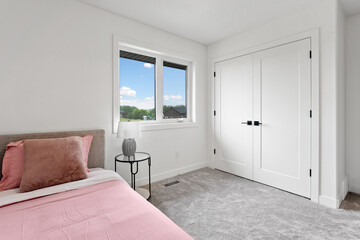 Bedroom with a white bed and a pink pillow