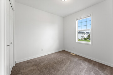 Bedroom with a window and a door