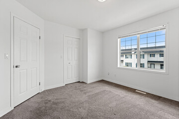 Bedroom with a window and a door