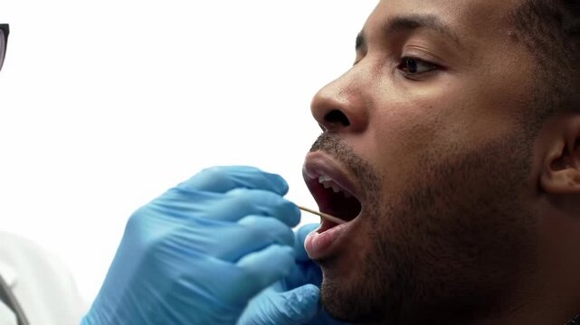 Doctor performing throat swab test