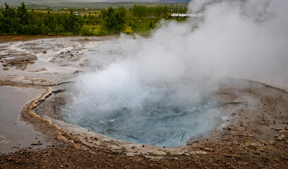 Steaming hot spring in the Haukadalur geothermal area near Strokkur geysir in Iceland on 9 June 2025