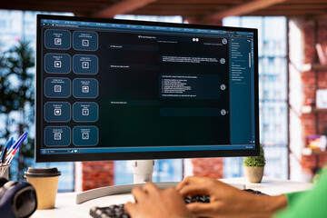 Student at home using AI LLM chatbot software to get help with solving homework, close up. Man...