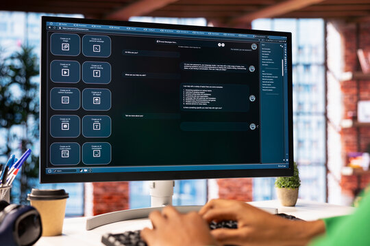 Student at home using AI LLM chatbot software to get help with solving homework, close up. Man requesting help from large language model program on computer device to do tasks