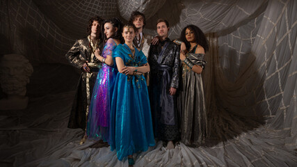 Arabic fairytale group photo, young men and women in luxurious oriental costumes, cinematic