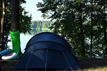 comfortable tourist tent among the trees