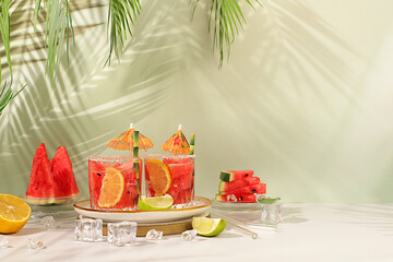 Mojito with lemon, mint, watermelon, ice with tequila, vodka or soda water on elegant background,...