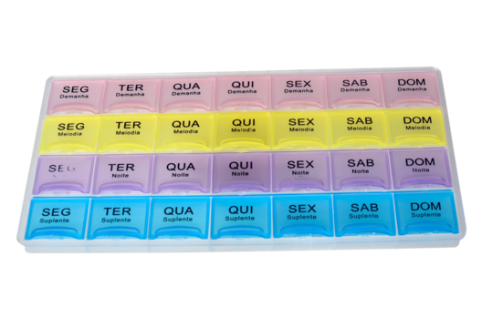 organized pill box with name in Portuguese of the days with pills isolated on white background