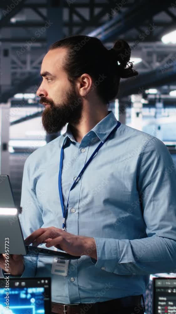 Poster vertical video data center technician using laptop to monitor neural network ai llm visualization. i