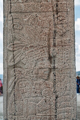 Close-up of carved Toltec figure on ancient stone column at Tula archaeological site in Mexico
