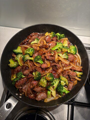 A pan of beef and broccoli.