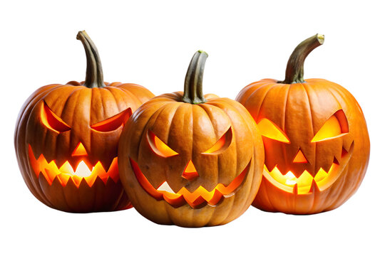 Three carved pumpkins with glowing lights and scary faces, ready for halloween night, isolated on a transparent background