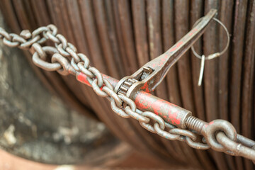 Steel chain and hook securing anchor, using to secure heavy object that transported on the trailer...