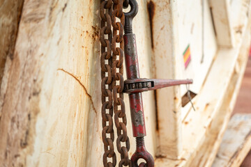 Steel chain and hook securing anchor, using to secure heavy object that transported on the trailer...