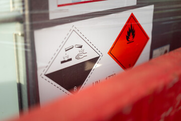 Acidity corrosion or skin burn hazard, safety sign on the chemical containment barrel. Sign and...