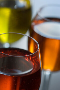 A visually engaging arrangement of red, yellow, and orange cordials creating a vibrant and artistic composition