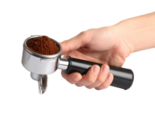 Hand holding a portafilter with freshly ground coffee isolated on a transparent background..