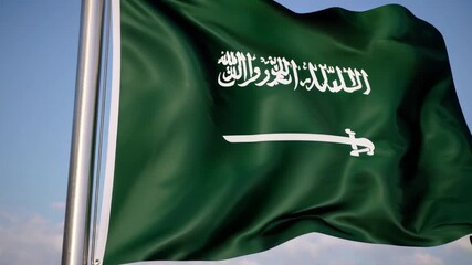 Saudi Arabia flag waving against a clear blue sky showcasing national pride and heritage