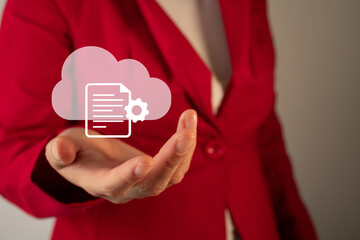 Cloud settings concept. A businesswoman holding a cloud icon, a document, and a gear.
