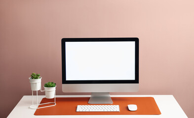 Stylish workplace with computer and orange mousepad on white table indoors. Space for text