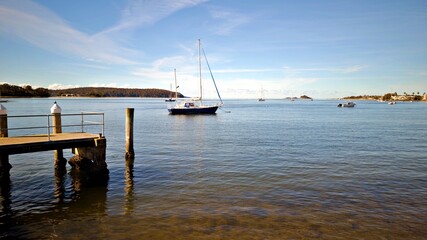 Batemans Bay with boats and wooden piers.