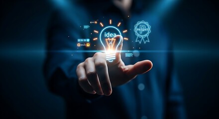 Obraz premium Patent registration concept. A hand holds a glowing holographic lightbulb icon with a small, simple 