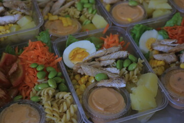 Vegetable salad served in a plastic cup can be packed to take away