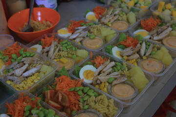 Vegetable salad served in a plastic cup can be packed to take away