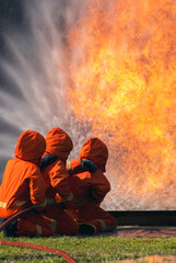 Vertical Horizon Firefighter Rescue training in fire fighting extinguisher. Firefighter fighting...