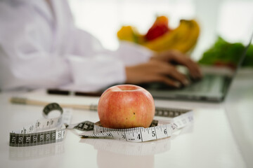 A professional dietitian consults with patients online, discussing nutrition, weight loss, and...