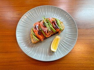 Smoked salmon open sandwich with avocado 