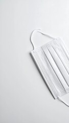 Empty face mask laying flat without human presence