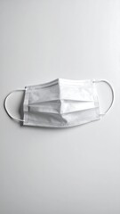 Empty face mask laying flat without human presence