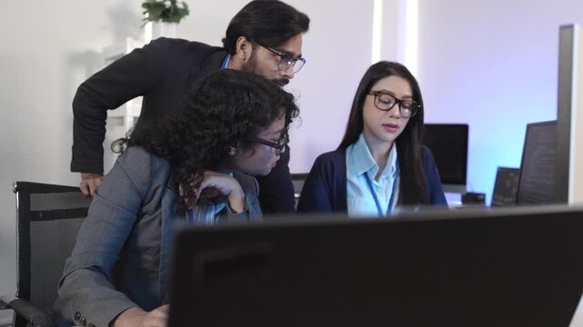 A dedicated IT team collaborates in a command center, working on a critical software deployment or incident response. Concept for system implementation, teamwork, and operations.