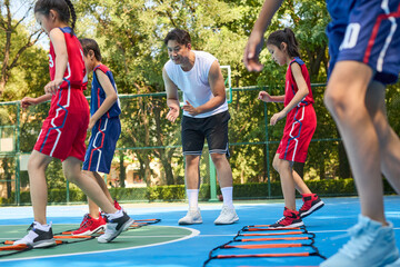 Kids Warming Up During Basketball Training Class
